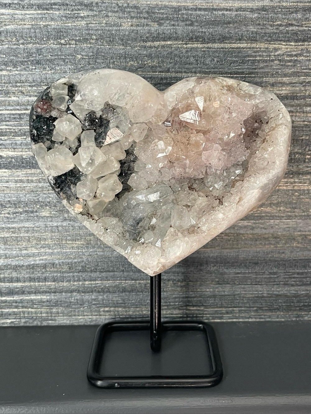 Natural amethyst heart on black stand